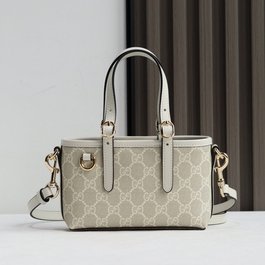 Gucci GG Emblem Handbag 855491 in Brown